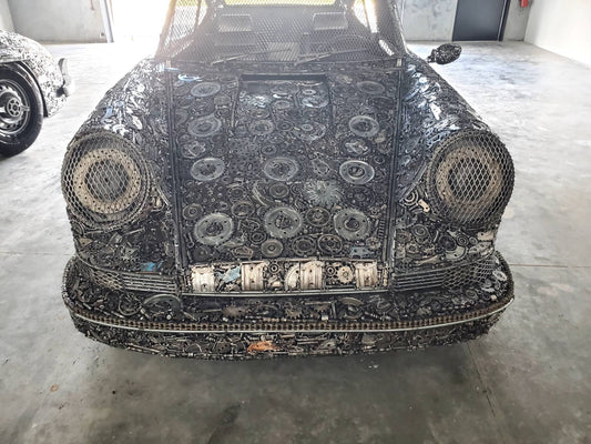 Carrera RS inspired full-scale classic recycled metal sculpture, front view with mesh headlights