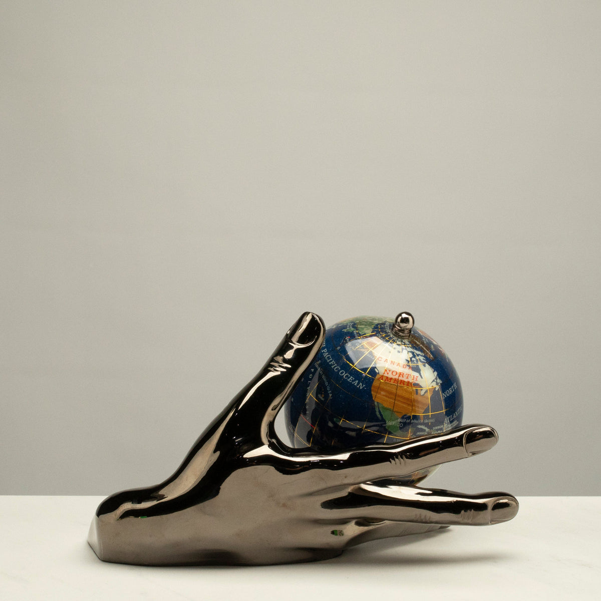 World In Your Hand - Gemstone Globe with Lapis Ocean Embraced with Gun Metal Base — Vault 88