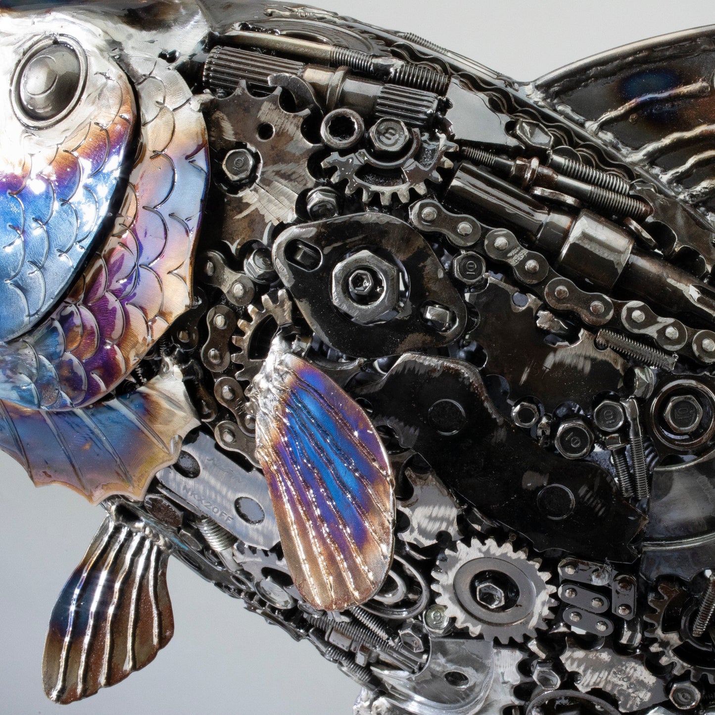 Koi fish metal sculpture angle view