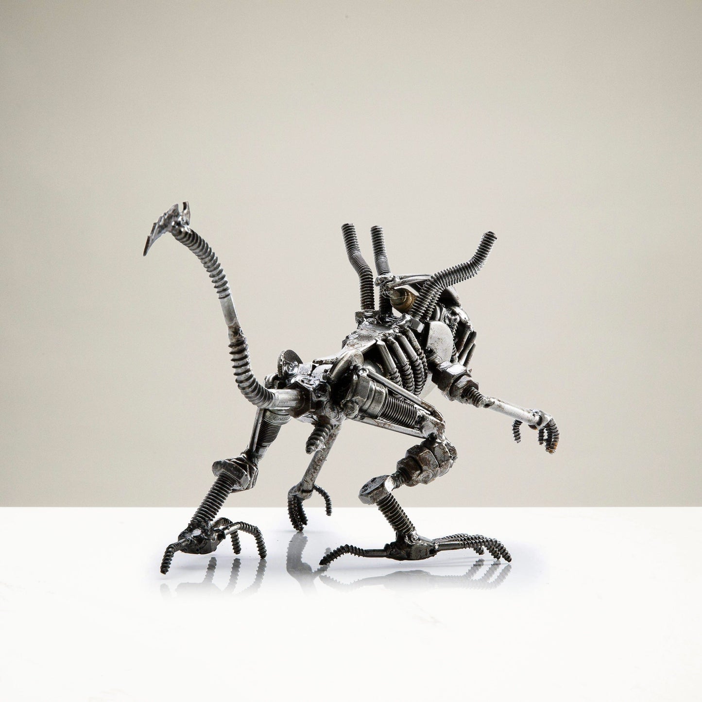 Alien crouched sculpture detail