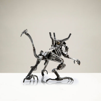 Alien crouched sculpture detail