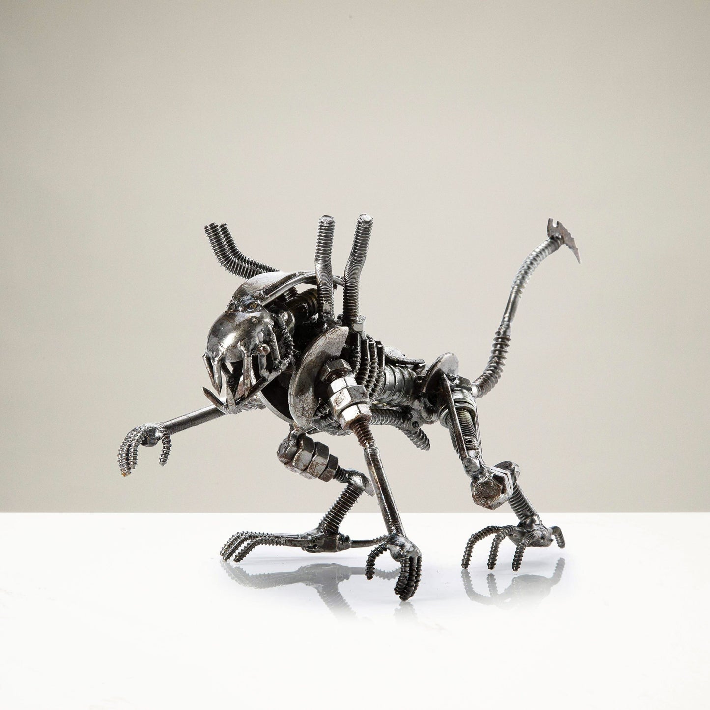 Alien crouched inspired recycled metal sculpture — Vault 88
