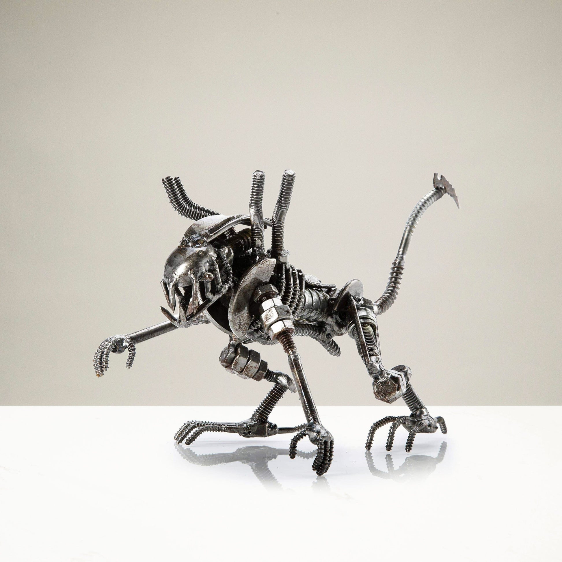 Alien crouched inspired recycled metal sculpture — Vault 88