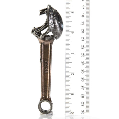 Alien bottle opener in use