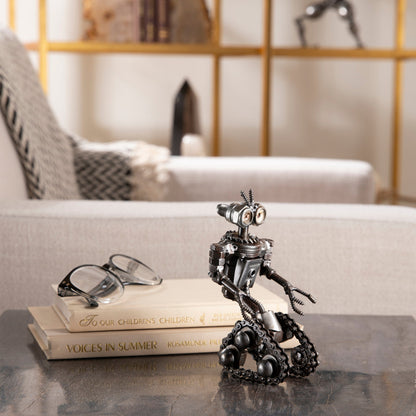 Johnny-5 metal sculpture styled on a desk — Vault 88