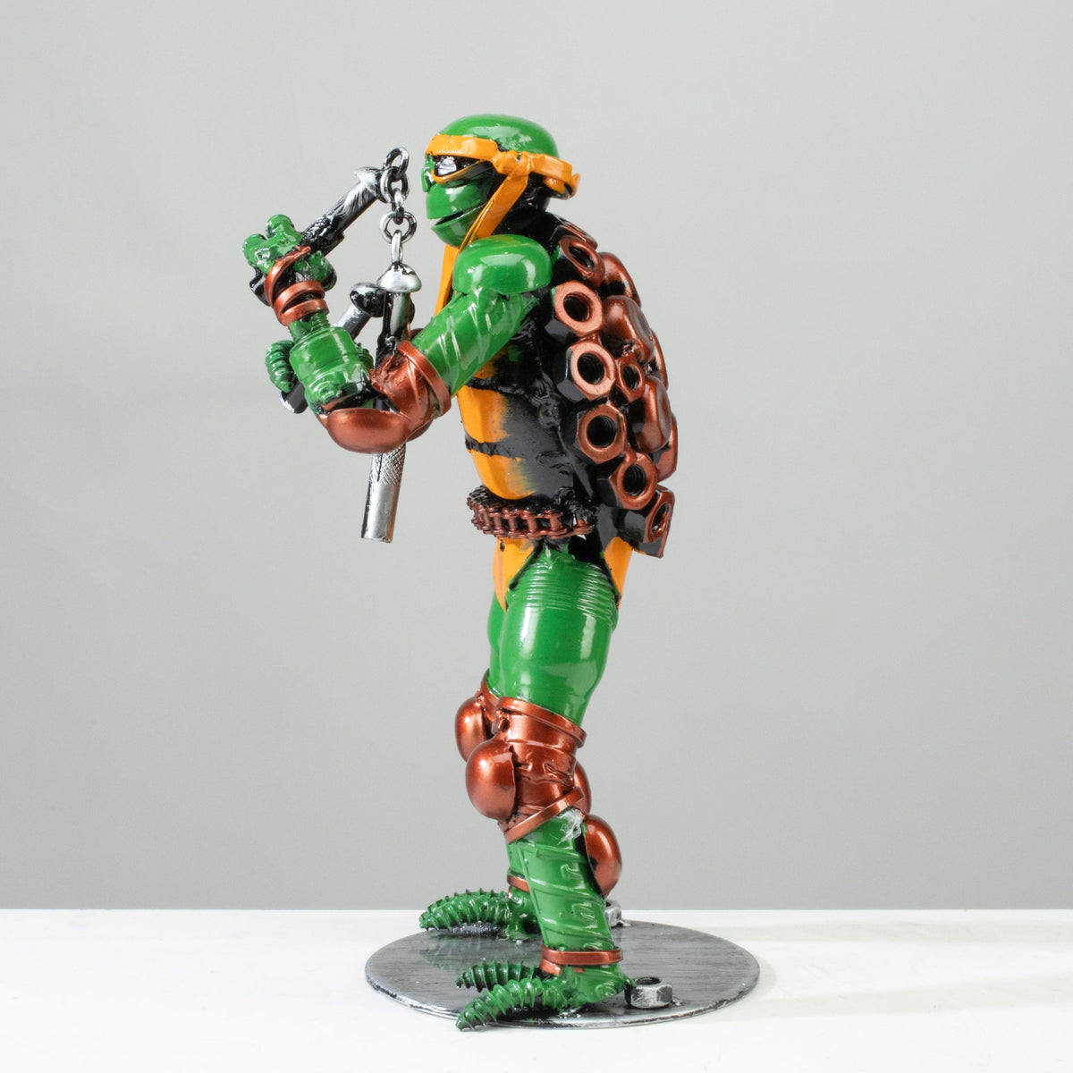 Michelangelo metal sculpture nunchuck detail — Vault 88