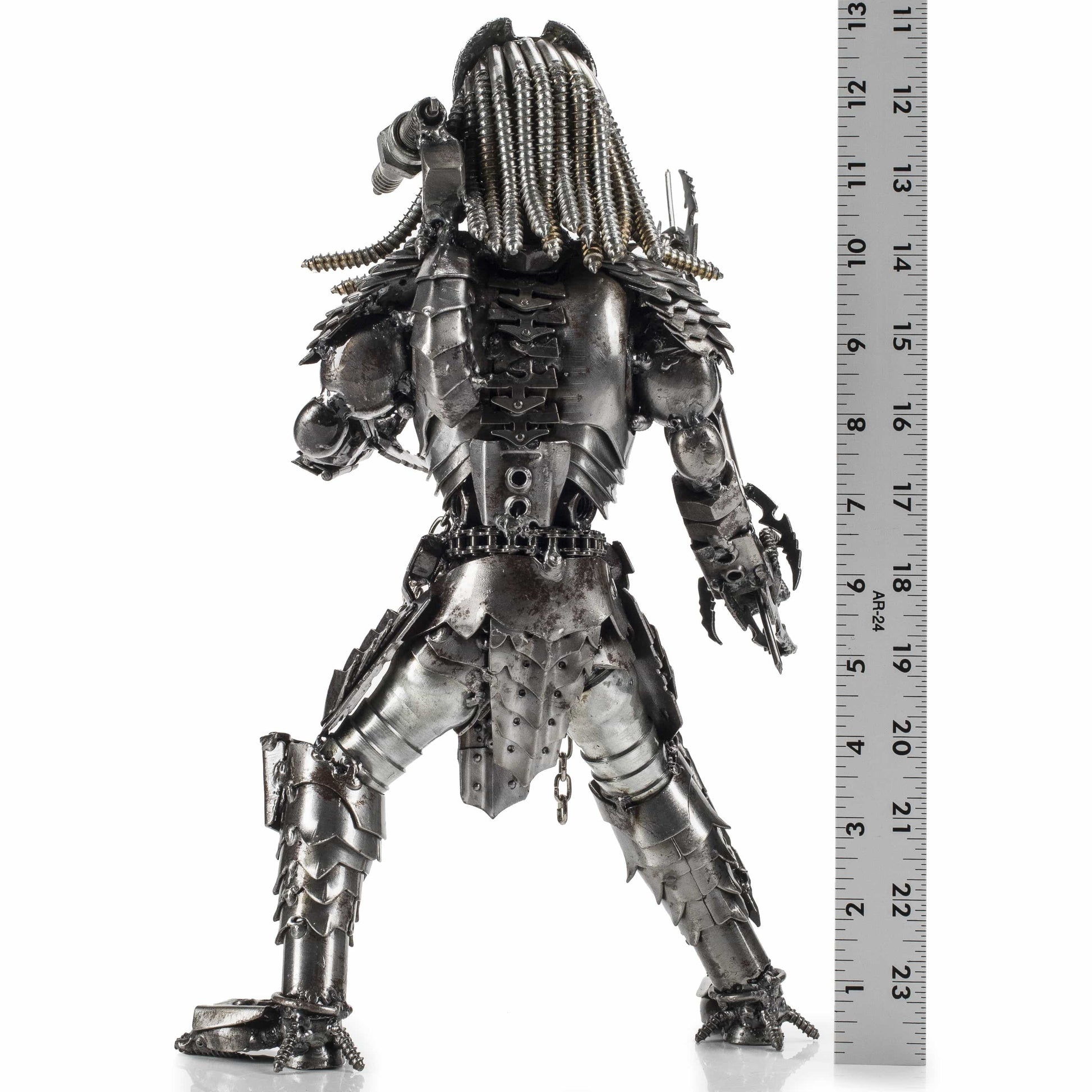 Predator brass sculpture side view