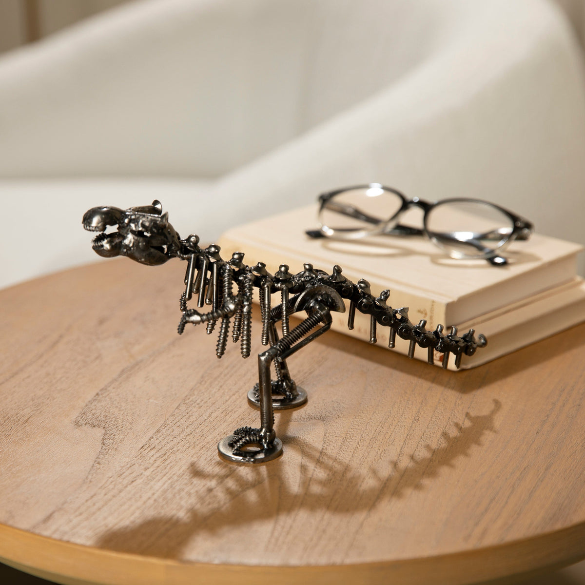 T-Rex metal sculpture styled on a table — Vault 88