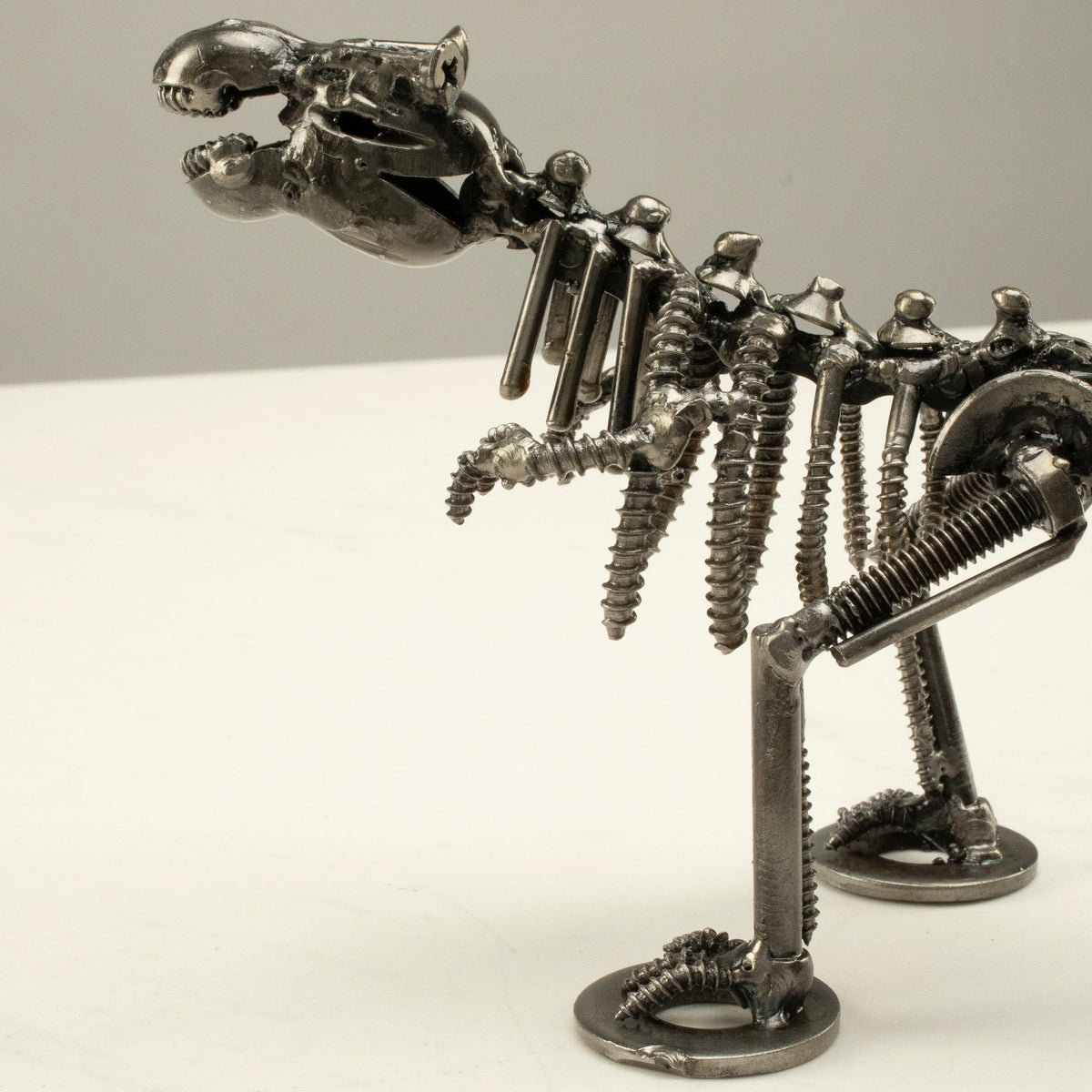 T-Rex metal sculpture jaw detail — Vault 88