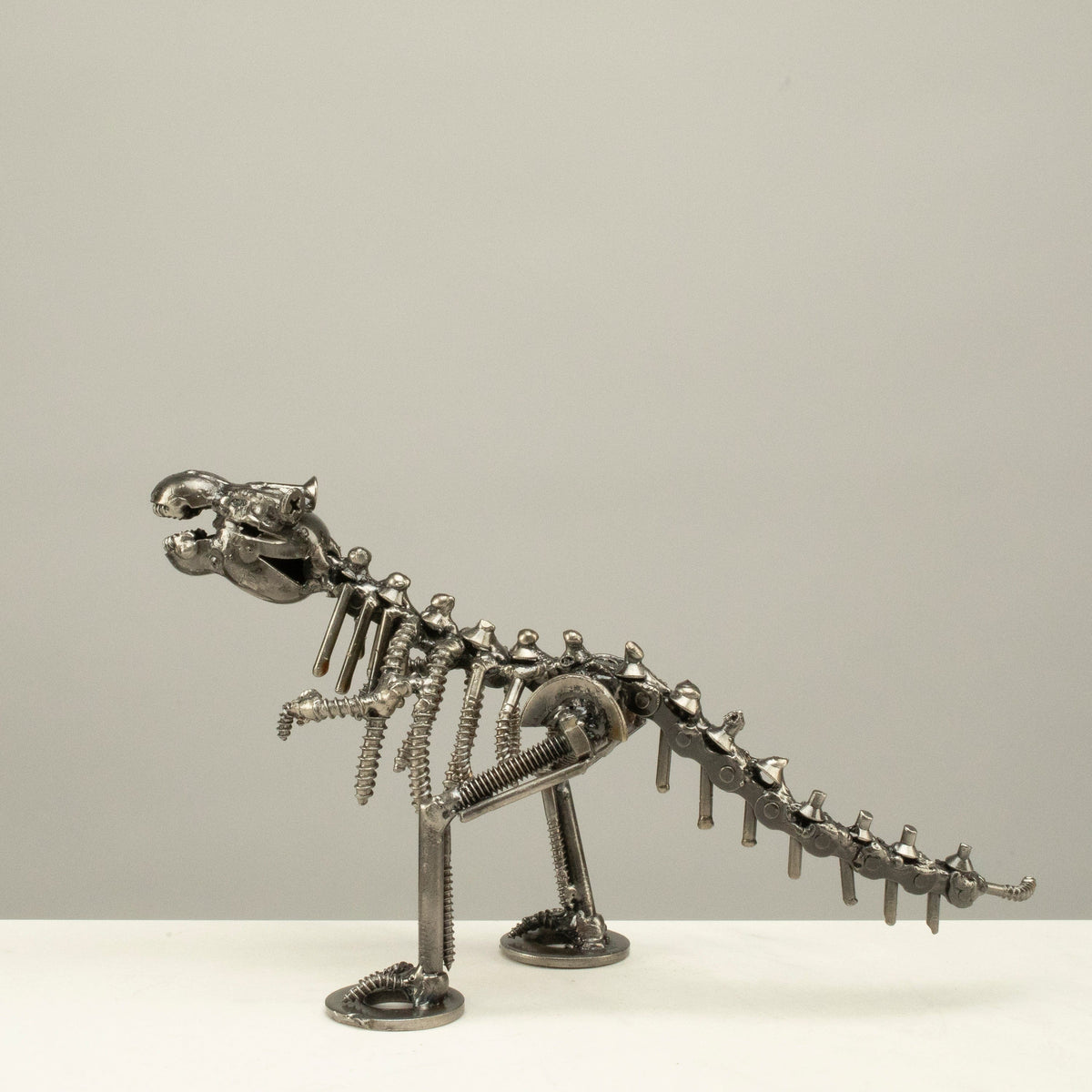 T-Rex metal sculpture tail detail — Vault 88