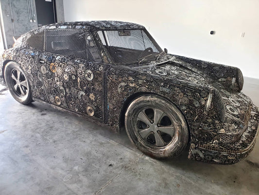 Carrera RS inspired full-scale classic recycled metal sculpture, side profile with gear mosaic body