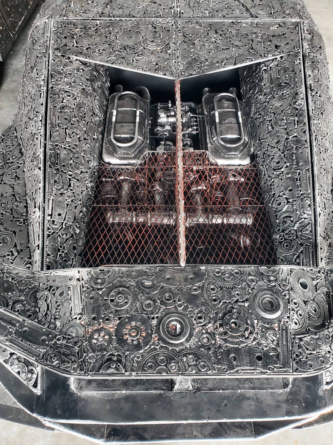 Chiron-inspired full-scale hypercar recycled metal sculpture, sculpted engine bay detail
