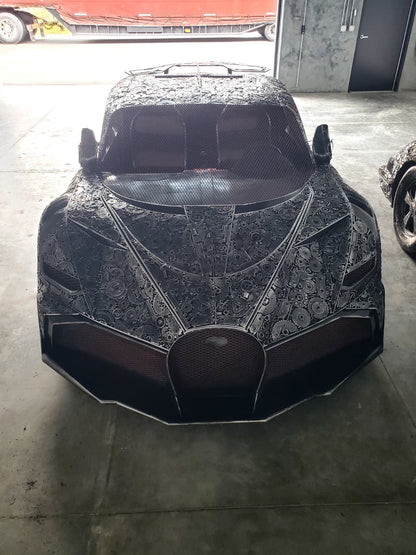 Chiron-inspired full-scale hypercar recycled metal sculpture, front view with signature grille