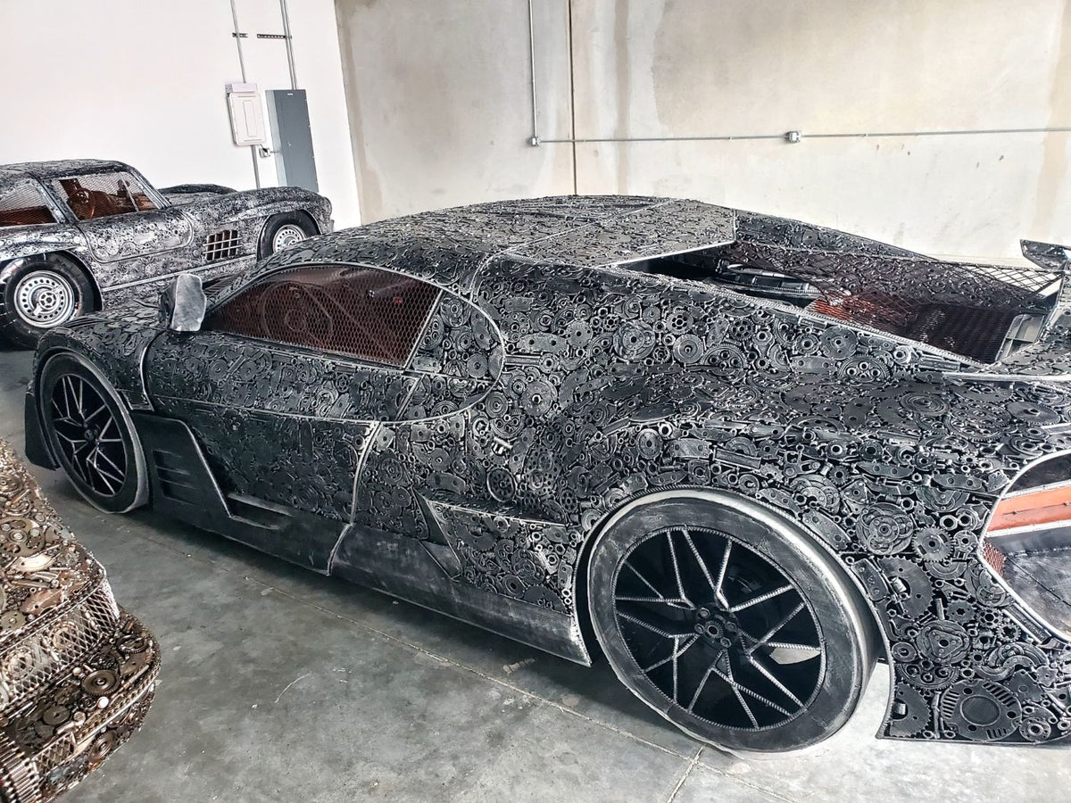 Chiron-inspired full-scale hypercar recycled metal sculpture, rear quarter with wing