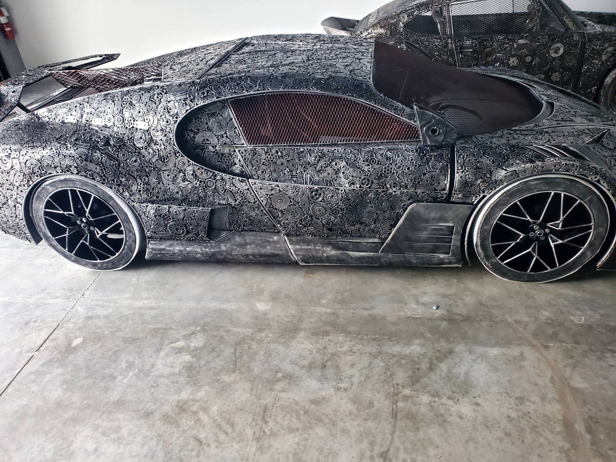 Chiron-inspired full-scale hypercar recycled metal sculpture, full side profile of gear-covered body