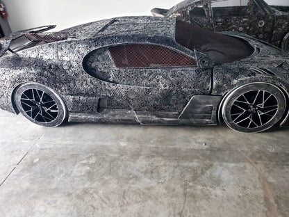 Chiron-inspired full-scale hypercar recycled metal sculpture, full side profile of gear-covered body