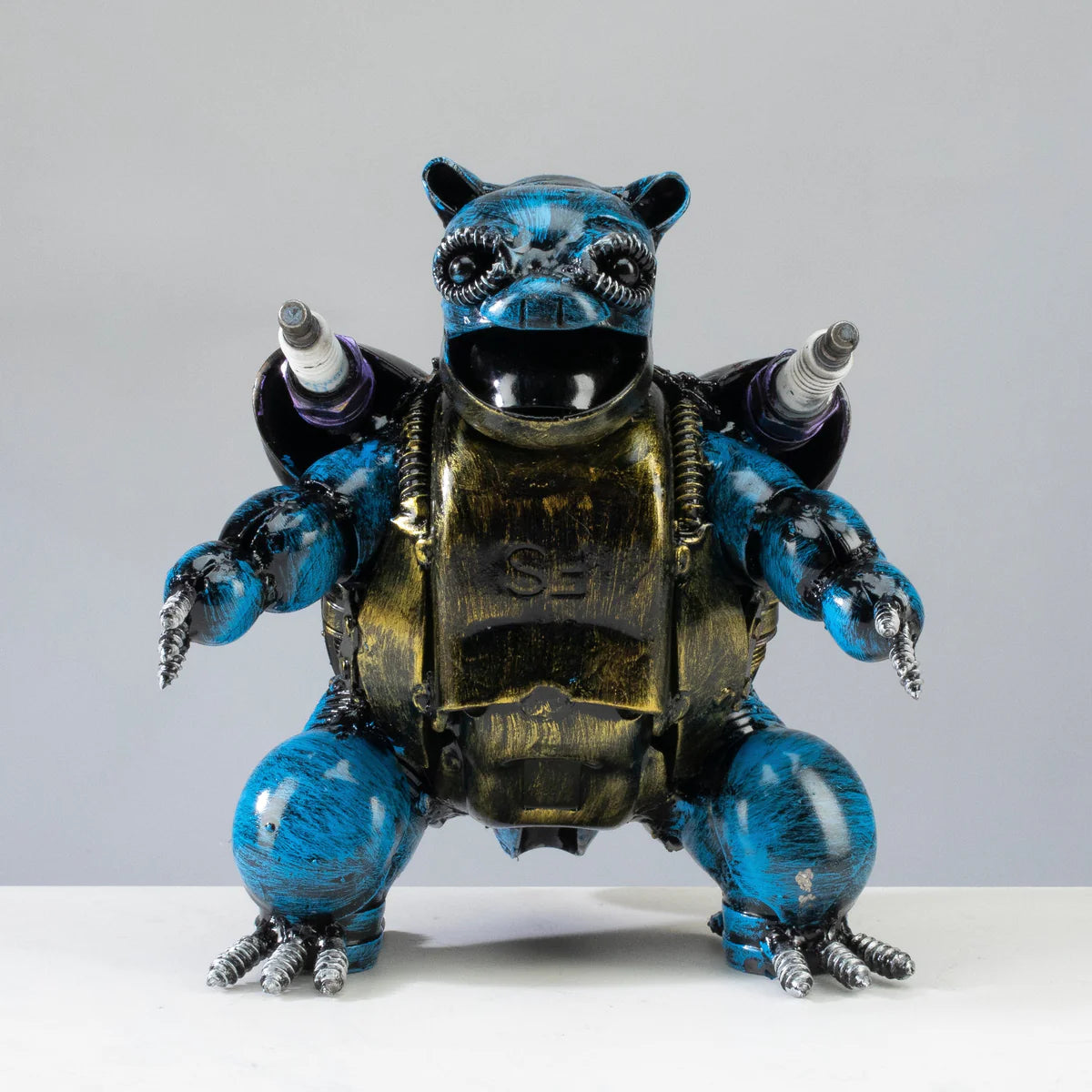 Blastoise Pokémon inspired recycled metal sculpture — weld detail close-up — Vault 88